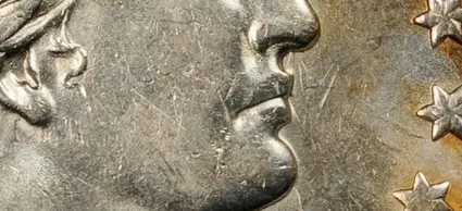 Contact marks, also called bag marks, are caused when newly struck coins at the Mint are thrown together and transported in canvas bags and other containers. Contact marks, also called bag marks, are caused when newly struck coins at the Mint are thrown together and transported in canvas bags and other containers.