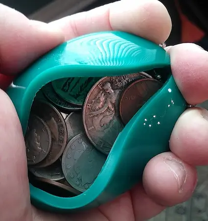 The squeeze coin holder, popular in the 1950s and 60s, did more than its share to wear down coins.